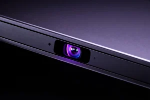 Google reCAPTCHA Camera Access - New Privacy Concerns 2026 9 A glowing webcam lens on a laptop illustrating google recaptcha camera access privacy concerns in a dark room.